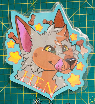 A posca badge for a mutt dog named Hen